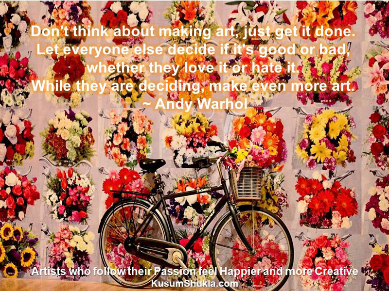 Andy Warhol quote with his art and a black bicycle in the background